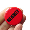 Resist Button at Golden Rule Gallery in Excelsior