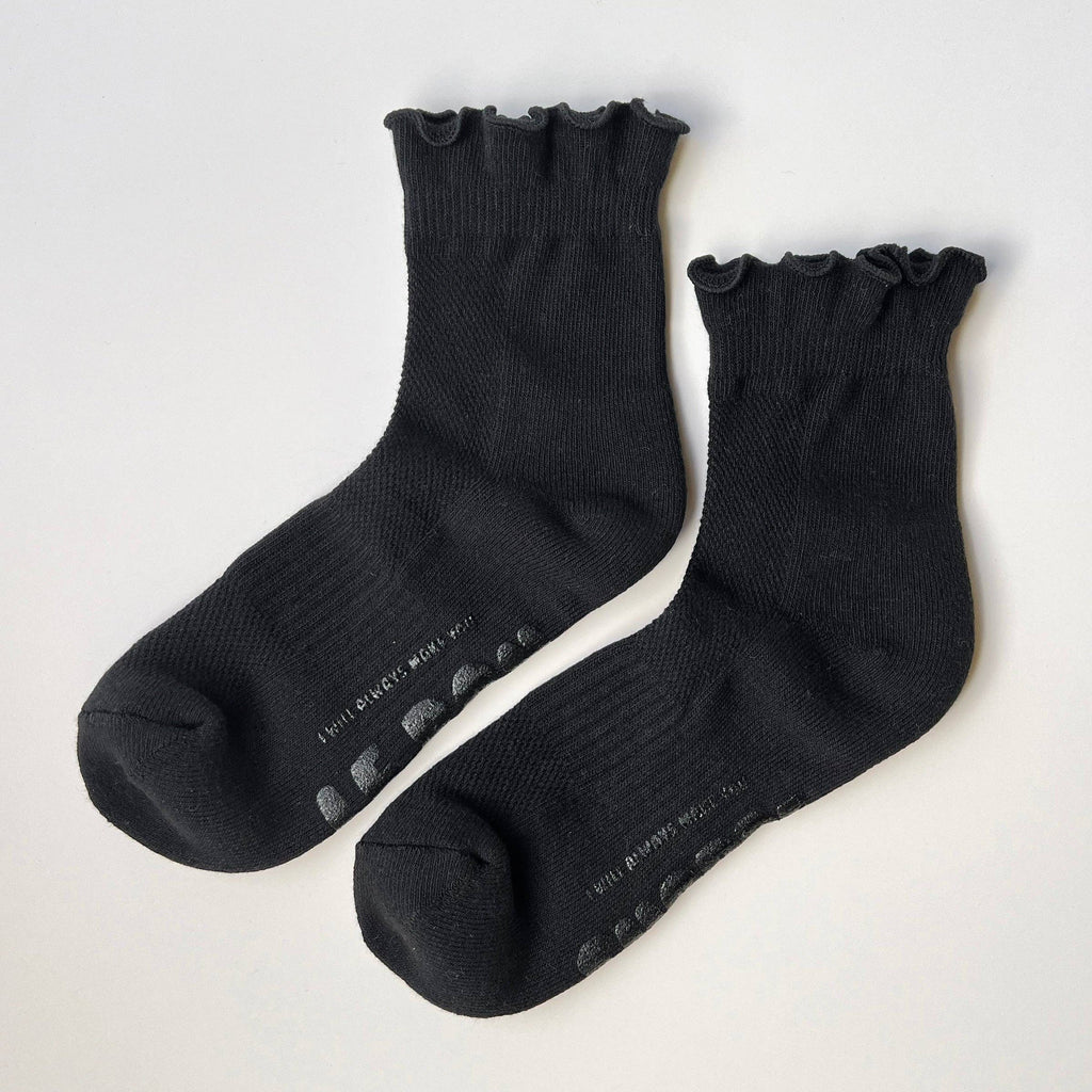 Pair of black socks on a white background
