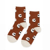 Brown socks with sheep pattern on a white background