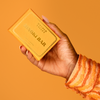 Hand Holding Soap Bar by Wonder Valley