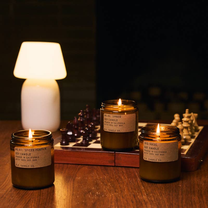 PF Candles Lit Next to a Chess Board