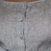 Close-up of a buttoned-up shirt with a striped pattern