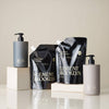 Element Brooklyn shampoo and conditioner bottles on a neutral background