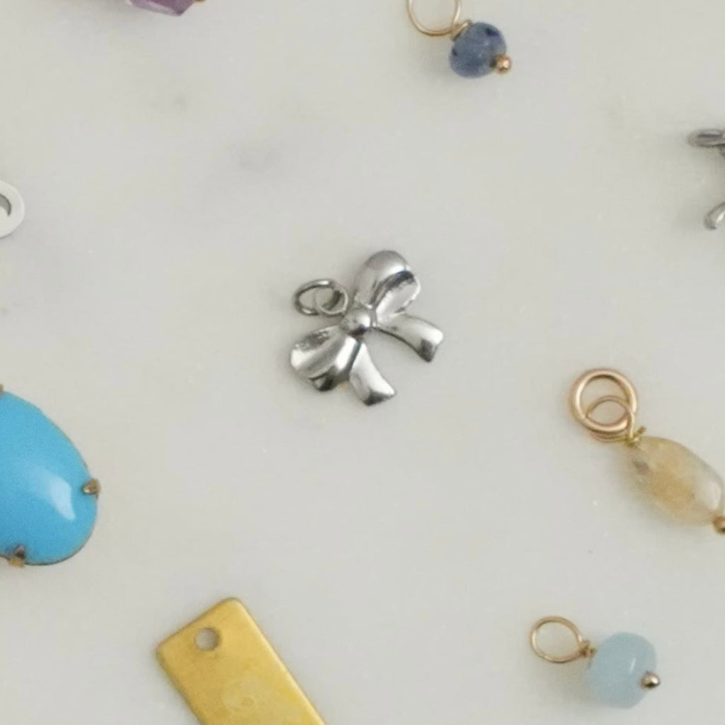 Cute, sweet, delicate, dainty, demure, elegant — these darling little charms bring classically feminine images to mind. Charms can be applied to necklaces or bracelets. 