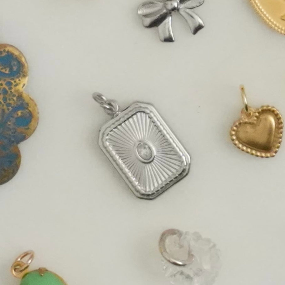 Cute, sweet, delicate, dainty, demure, elegant — these darling little charms bring classically feminine images to mind. Charms can be applied to necklaces or bracelets. 