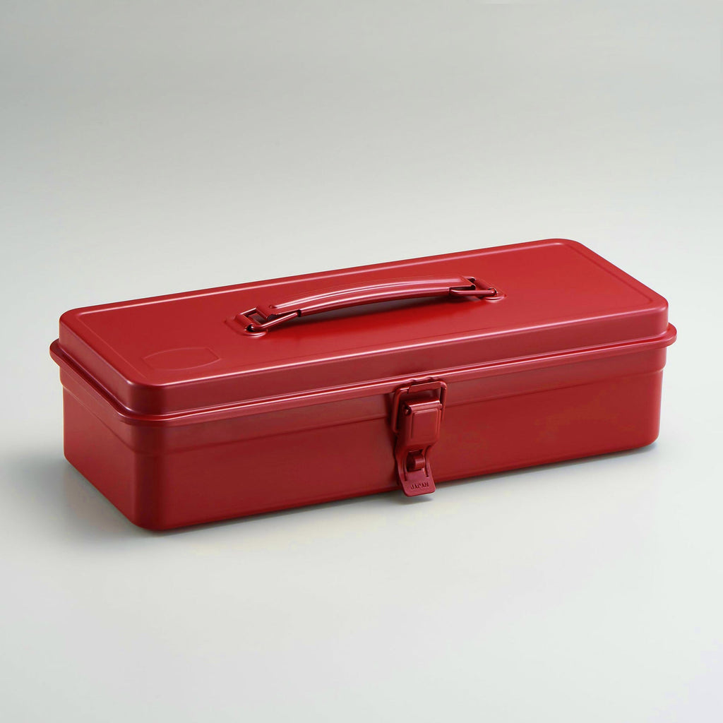 Red toolbox with a handle on a light gray background