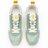 Pair of light green sneakers with white laces on a white background