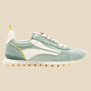 Green and white sneaker with a yellow accent on a white background by Oncept at Golden Rule