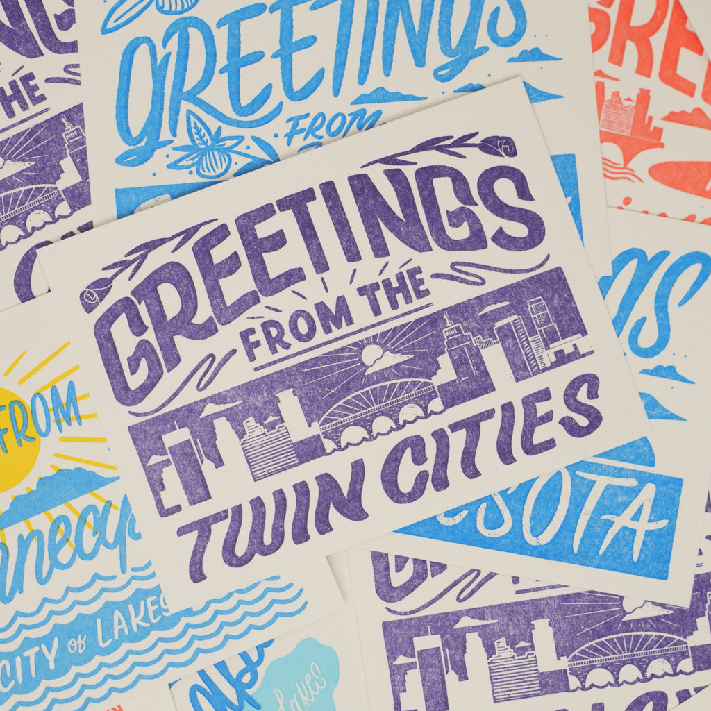 Greetings from The Twin Cities Purple Postcard at Golden Rule Gallery