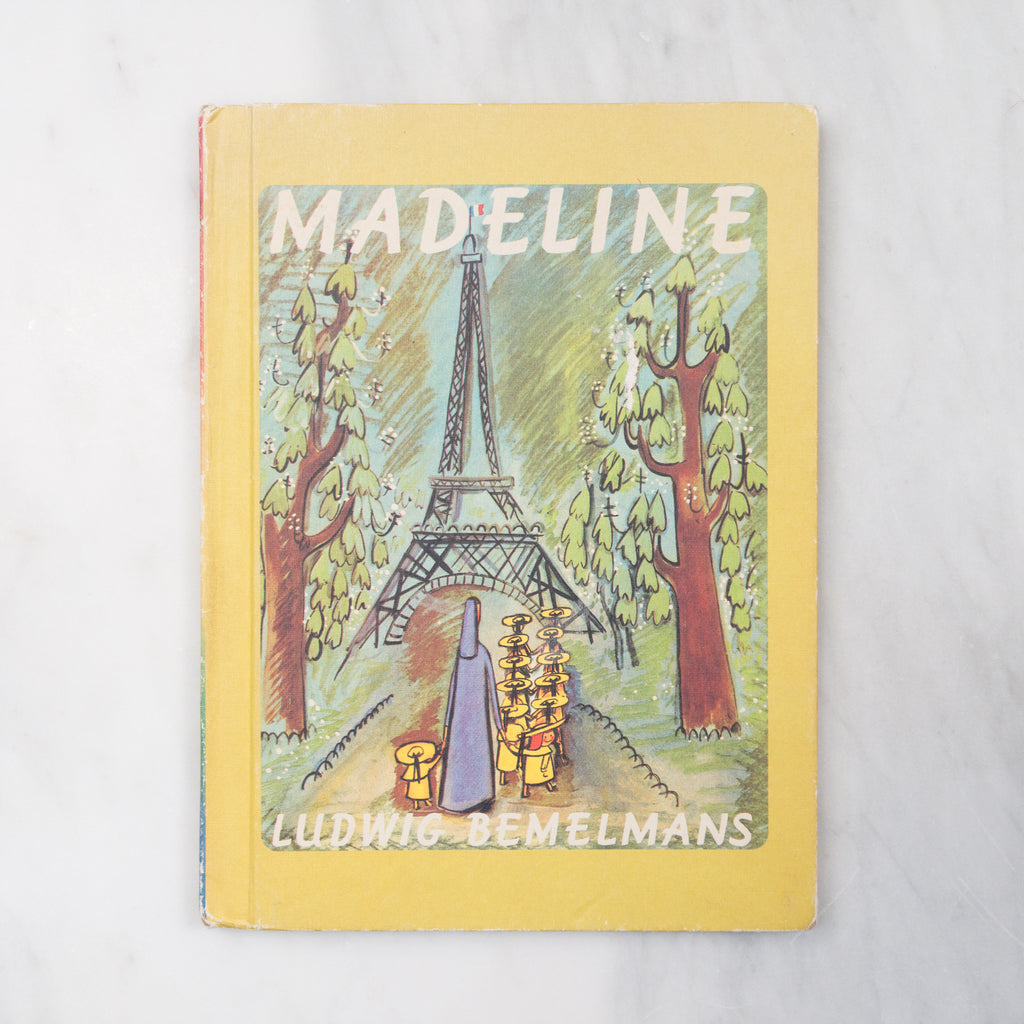 Book cover of 'Madeline' with the Eiffel Tower illustration on a yellow background