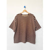 Brown and white striped voyage shirt on a hanger against a white background