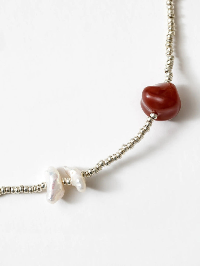 Close up pf Pearl & Stone on Wolf Circus Scarlet Necklace 