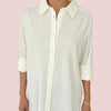 White button-up shirt worn by a person on a pink background