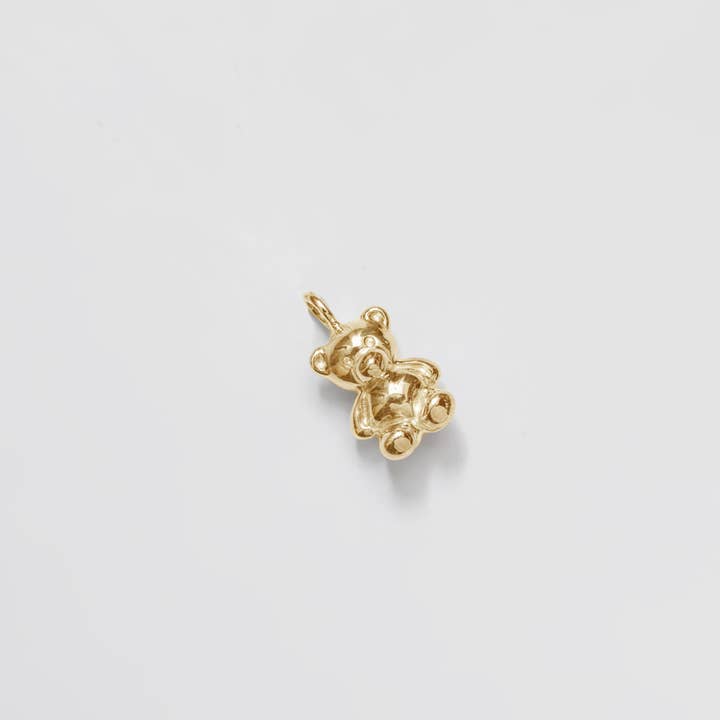 Wolf Circus Single Mini Teddy Bear Charm in Gold at Golden Rule Gallery in Excelsior, Minnesota