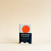 Soap bar with a red circle and 'Wonder Valley' branding on a beige background