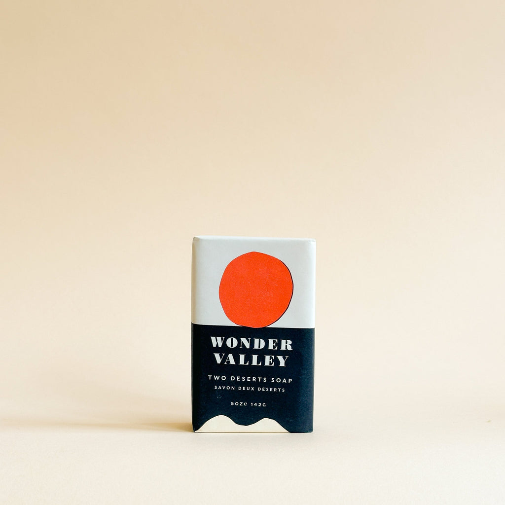 Soap bar with a red circle and 'Wonder Valley' branding on a beige background