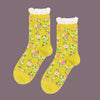 Yellow socks with floral pattern on a white background