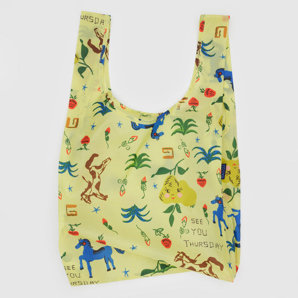 Reusable bag with colorful animal and nature pattern on a light yellow background