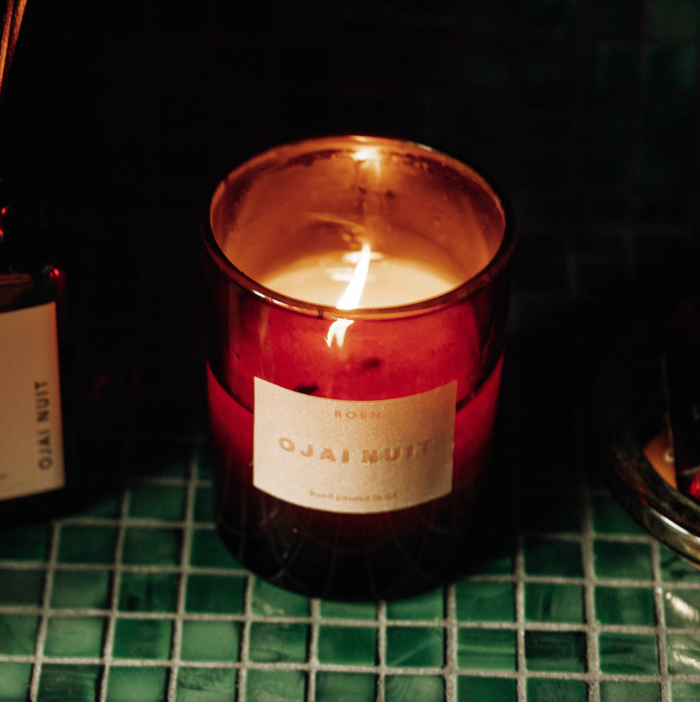 Roen Candle Burning on Counter