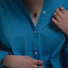 Close Up of Pigmented Blue Button Down Shirt by Le Bon Shoppe at Golden Rule Gallery
