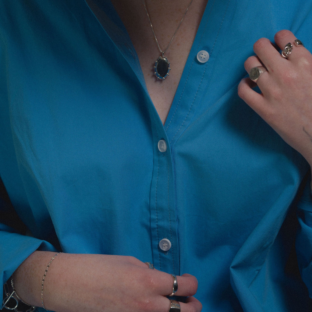 Close Up of Pigmented Blue Button Down Shirt by Le Bon Shoppe at Golden Rule Gallery