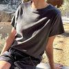 100% cotton dark grey boxy tee shirt on model