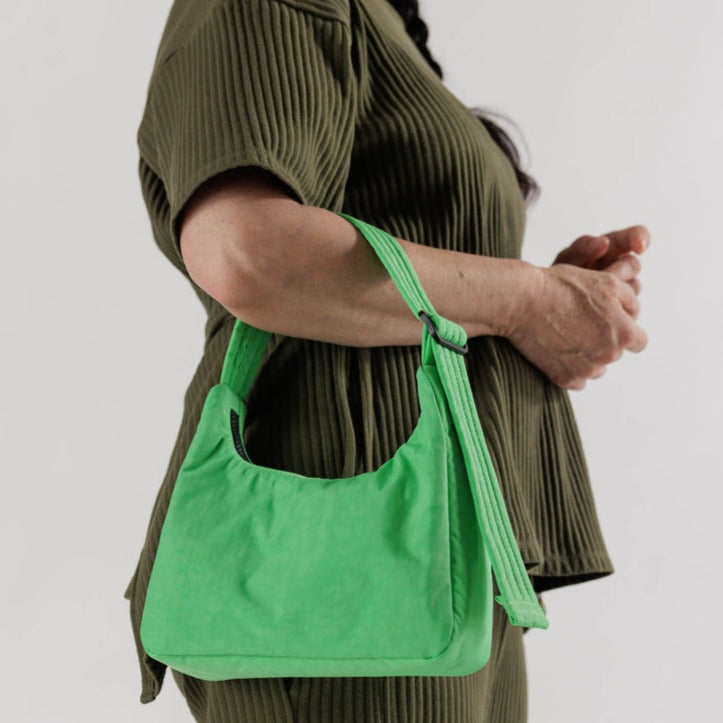 Model Holding Aloe Baggu Nylon Shoulder Bag