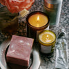 Flamingo Estate soap and candles on a bathroom counter