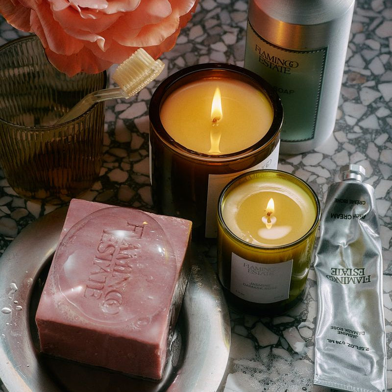 Flamingo Estate soap and candles on a bathroom counter