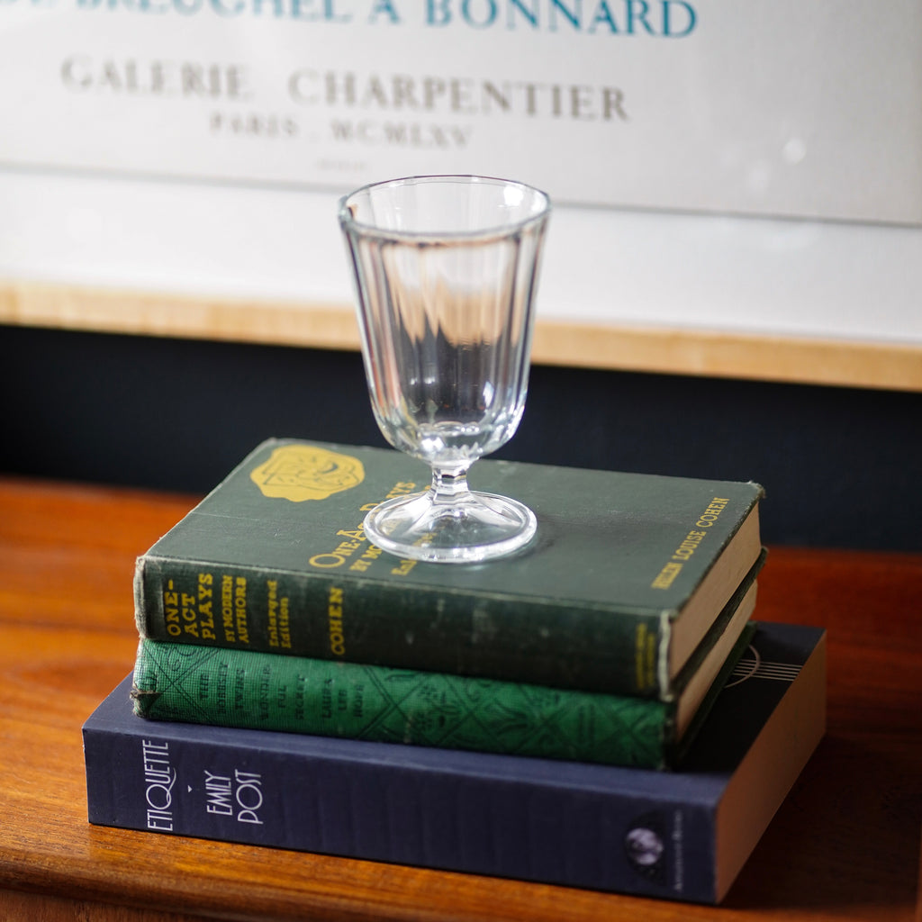 Anna Faceted Wine Glass Stacked on Books