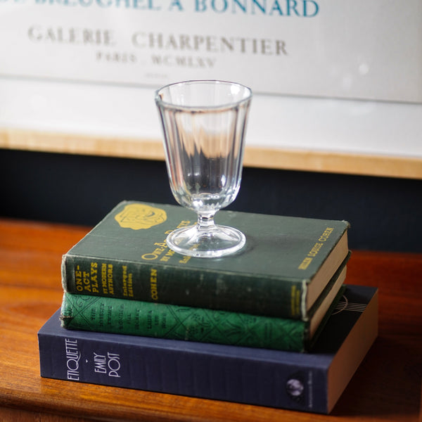 Anna Faceted Wine Glass Stacked on Books