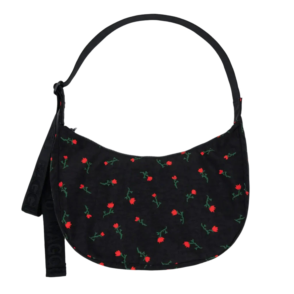 Black handbag with red rose pattern on a white background
