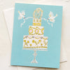 Greeting card with a decorative cake illustration on a light blue background