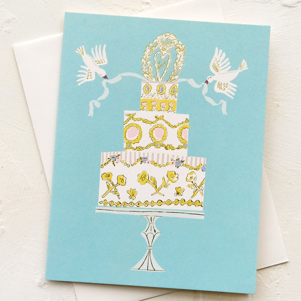 Greeting card with a decorative cake illustration on a light blue background