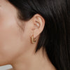 Gold Wolf Circus Camille Hoop Earrings Modeled on Woman