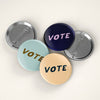 Vote Pin Back Button by August Ink at Golden Rule Gallery in Excelsior, MN