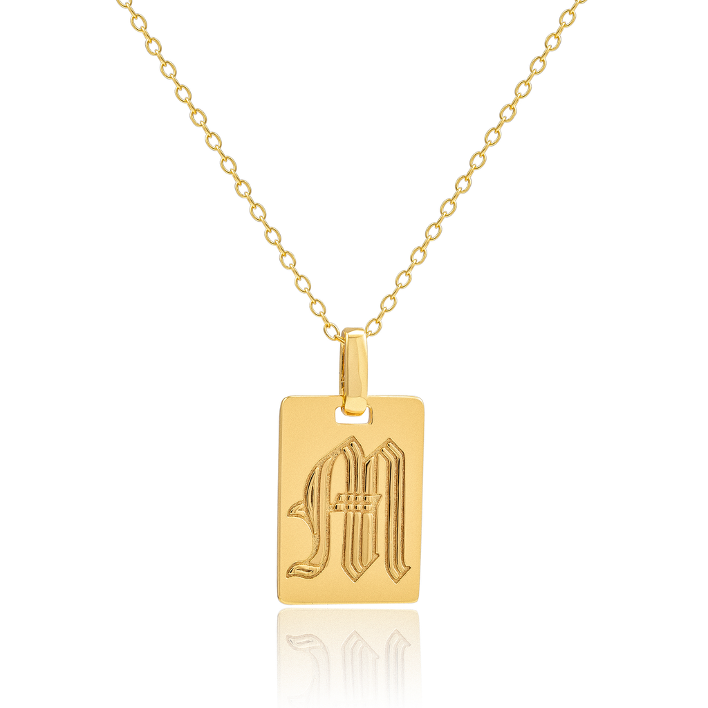 Old english script "M" initial pendant necklace by Mod + Jo at Golden Rule Gallery in Excelsior, MN