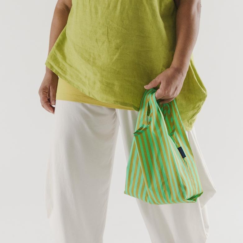 Model Holding Lawn Green Stripe Reusable Bag