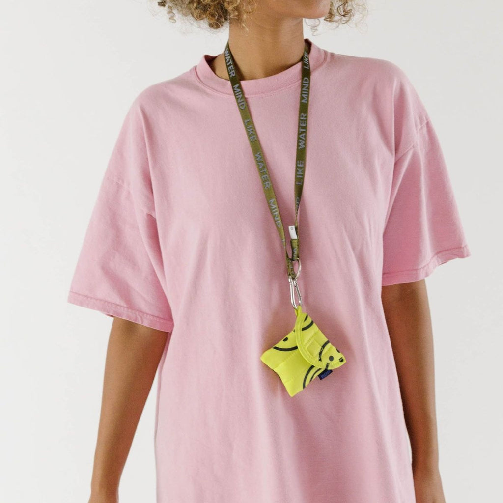 Earbud Case in Yellow Smiley Faces by Baggu at Golden Rule Gallery