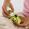 Yellow Happy Smile Airpod Case by Baggu at Golden Rule Gallery