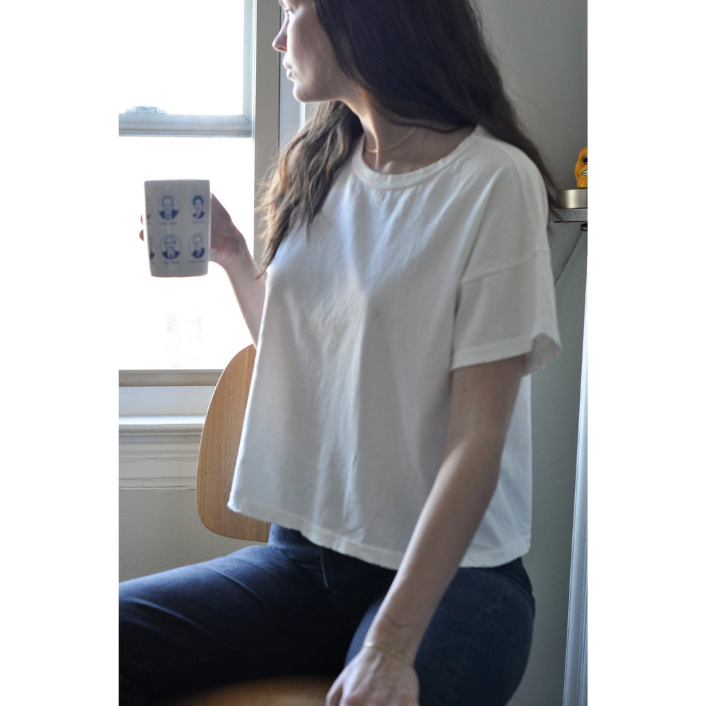 Classic White Fille Tee Shirt by Le Bon Shoppe on a Model sitting down 