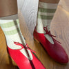 Cream Socks with Green Stripes Worn with Red Heels 