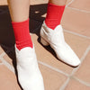 Model Wearing Le Bon Shoppe Her Socks in Classic Red