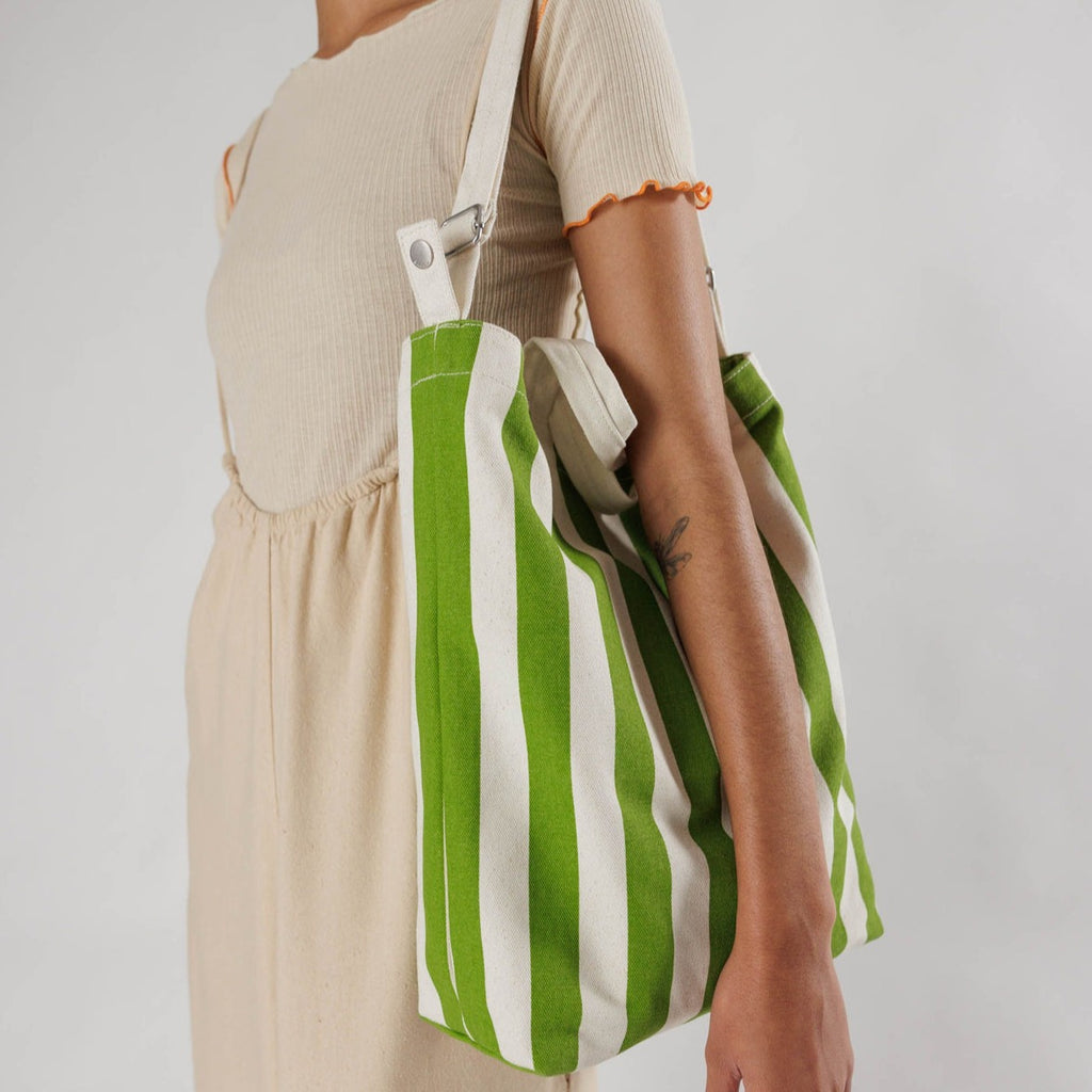 Model Wearing Green Awning Stripe Baggu Duck Bag Tote at Golden Rule Gallery