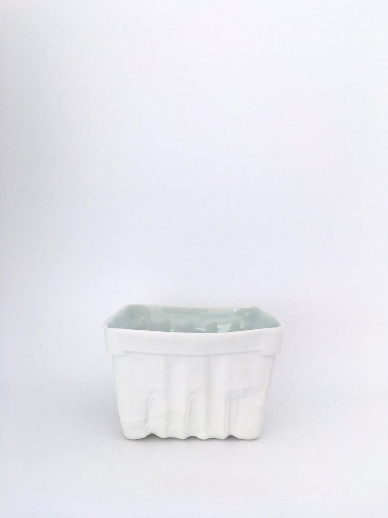 White ceramic farmer's market berry carton