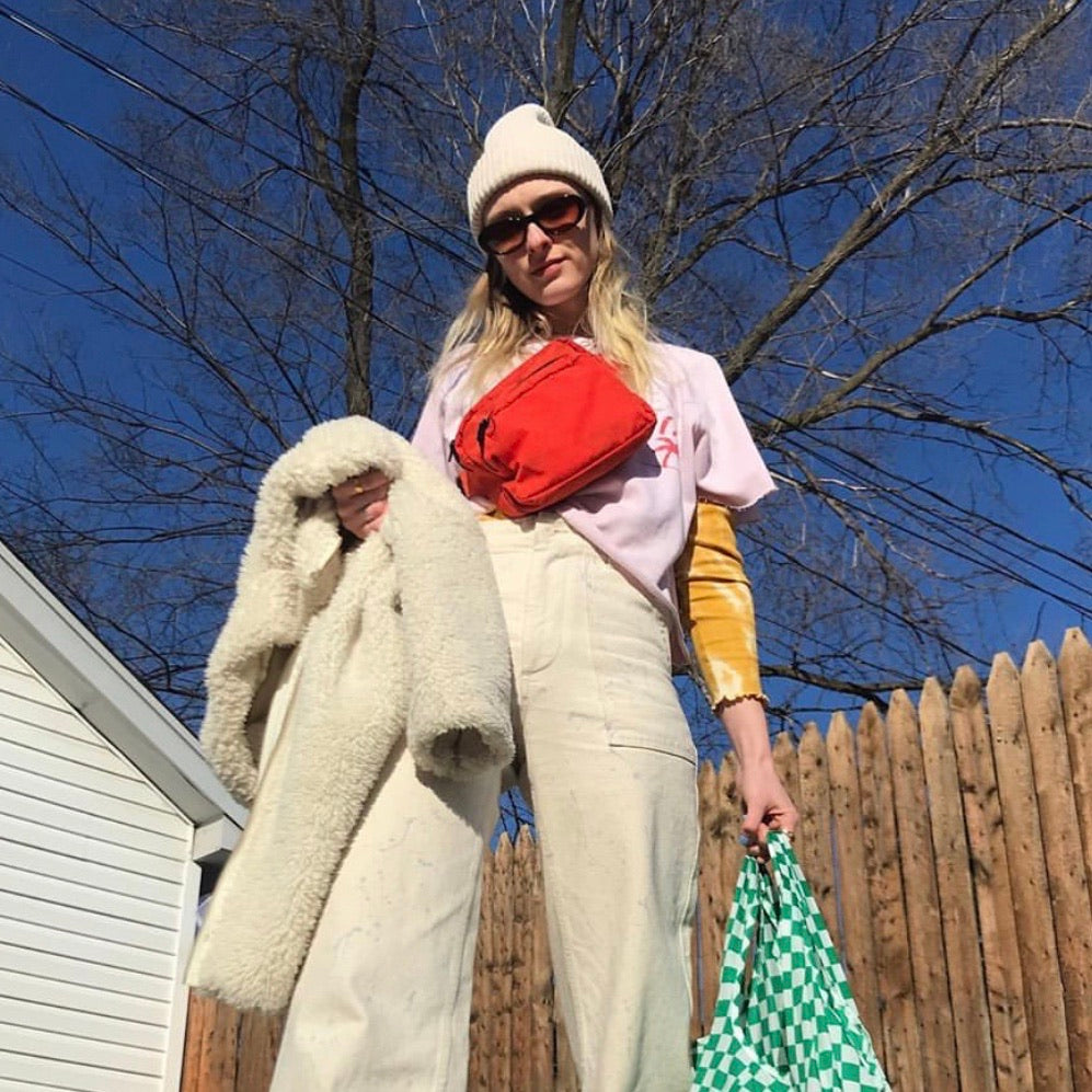 Model with Red Baggu Fanny Pack and Reusable Bad Outside