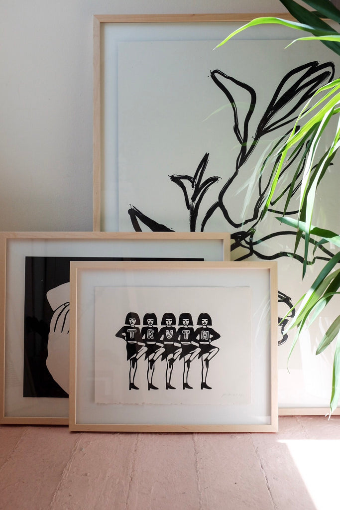We Are The Truth Cheerleader Linocut Framed Art by Jennifer Ament at Golden Rule Gallery in Excelsior, MN
