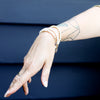 Stacked Dainty Pearl Bracelets Modeled on Tattood Hand