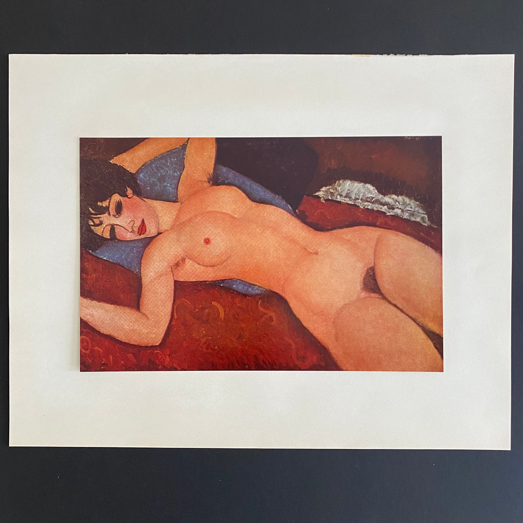 Vintage 50s first edition offset lithograph of a nude woman laying on a red cushion