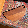 Half Circle Walnut Charcuterie Board on Rug